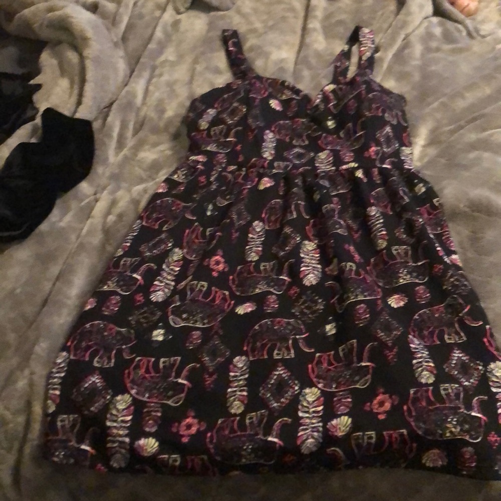 Littl black dress w designs elephants and feathers